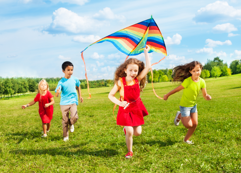 Kids Flying Kite Outdoors - Best Kid Summer Activity